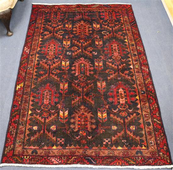 A Hamadan red and black ground rug, 6ft 2in 3ft 11in.